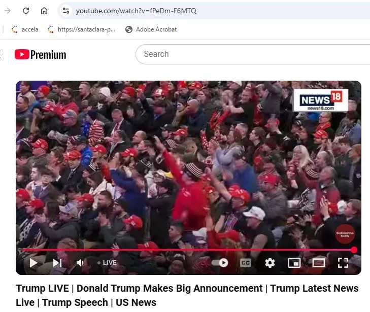 A screenshot of a YouTube video player showing a large crowd of people, many wearing red hats, cheering and raising their…