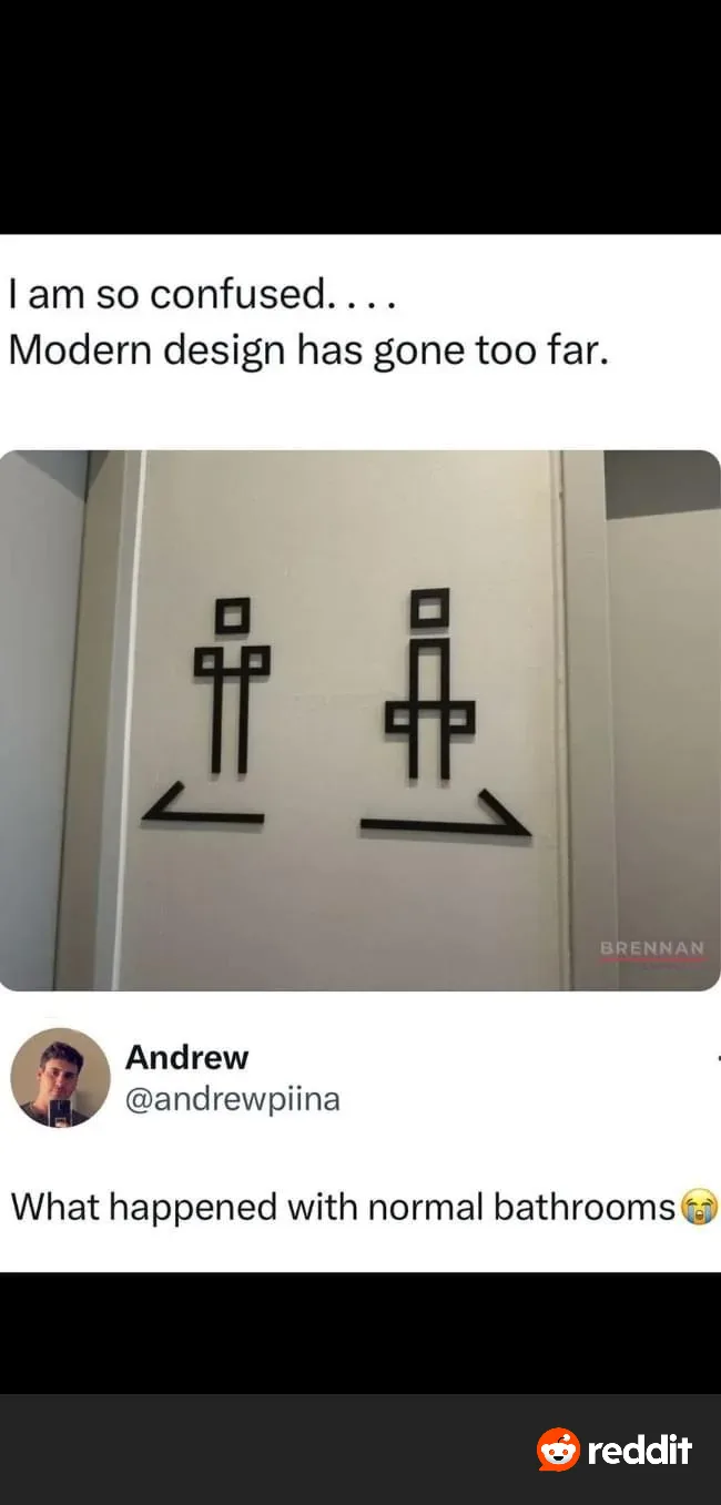 The image shows two minimalist, abstract black symbols on a white wall, resembling stylized human figures with arrows…