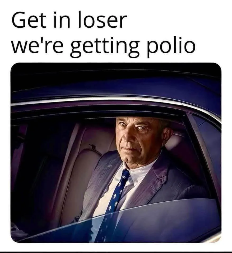A man in a suit and tie sits in the driver's seat of a car, looking sternly at the viewer. The overlaid text reads 'Get in…