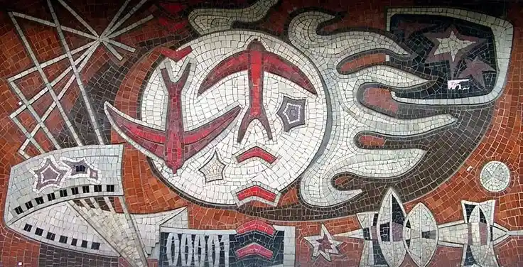 A mosaic artwork featuring abstract geometric shapes, red and white stylized symbols resembling a hammer and sickle, stars…