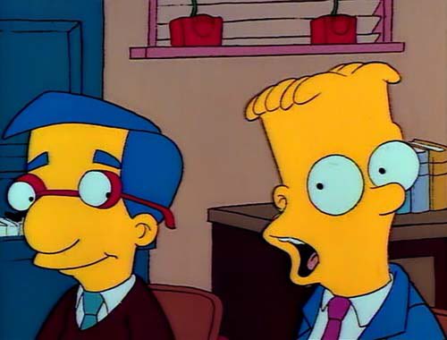 Bart Simpson, with wide eyes and an open mouth, looks shocked or surprised while sitting next to a calm, smiling man in a…