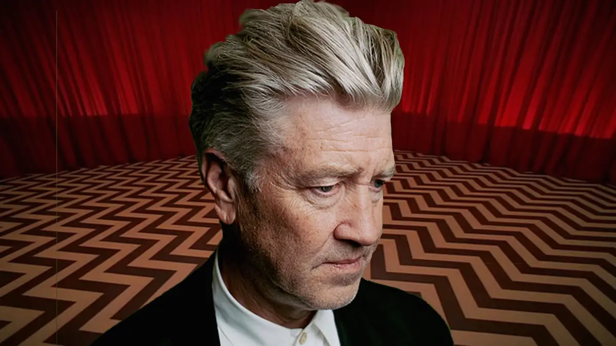 A man with graying hair and a serious expression is superimposed onto the iconic red curtain and zigzag-patterned floor from…