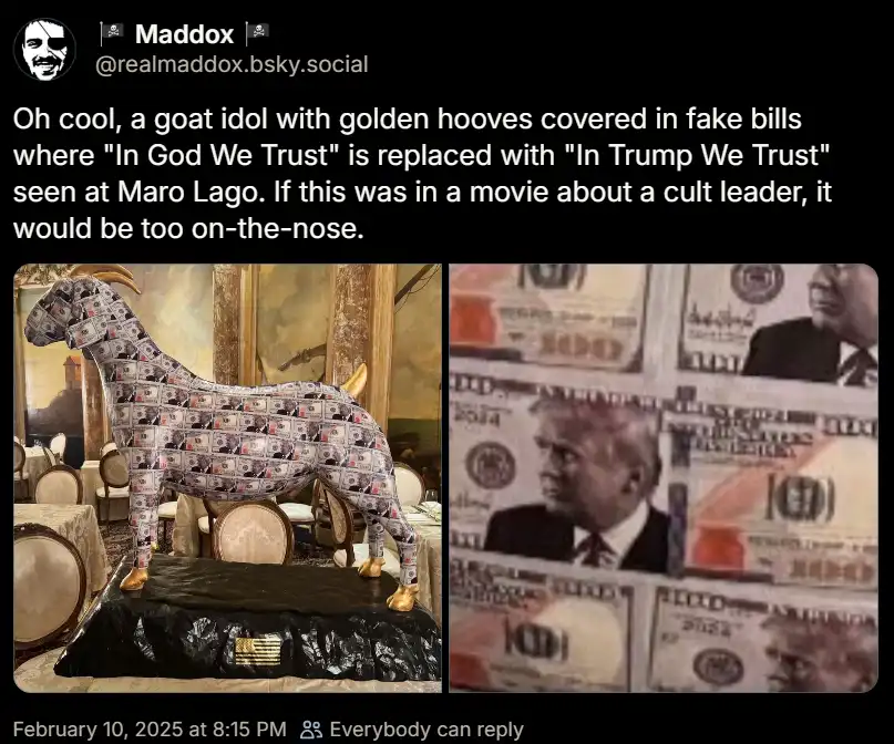 The image shows a large goat statue covered in fake $100 bills, with golden hooves and a black plastic base featuring an…