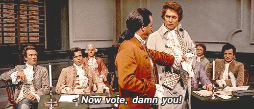 The image shows a repeated scene from a historical drama where a man in an 18th-century brown coat stands before a group of…