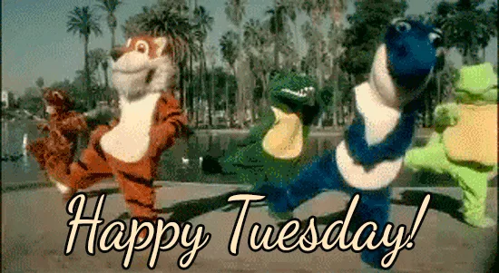 A repeating image of four costumed mascots—a tiger, a blue dinosaur, a green alligator, and a brown bear—dancing in sync…