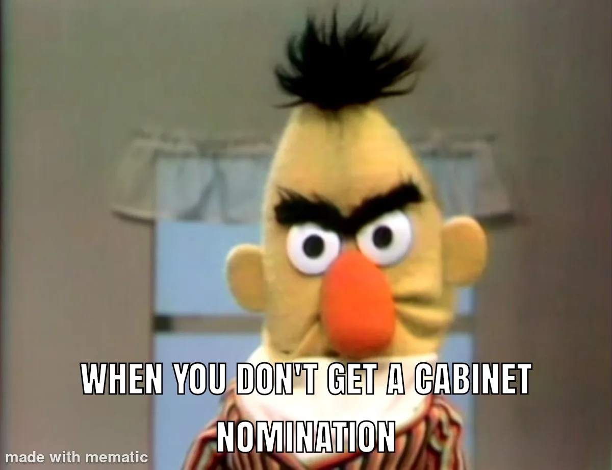 A close-up of the Muppet character Bert with an angry, furrowed brow and wide eyes, looking directly at the viewer. He has…