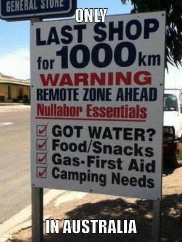 A sign for a 'GENERAL STORE' in Australia advertises itself as the 'LAST SHOP for 1000 km' and warns of a 'REMOTE ZONE…