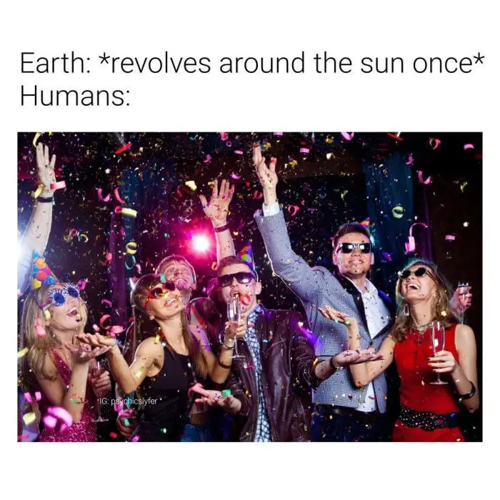 A group of people in party attire, wearing sunglasses and party hats, celebrating with confetti falling around them. They…
