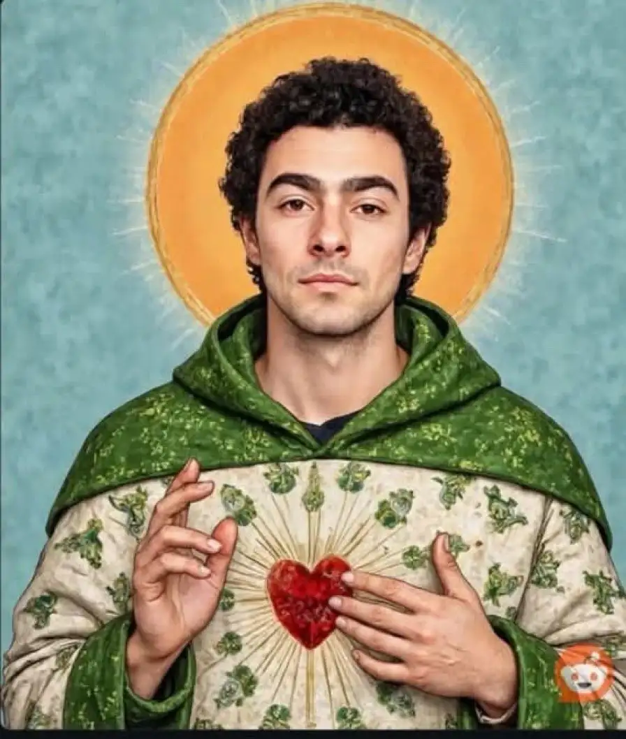 A man with curly dark hair and a neutral expression is depicted in a religious painting style, wearing a green hooded robe…