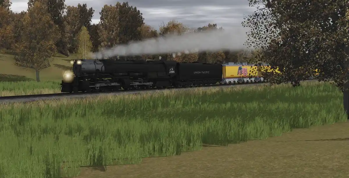 A steam locomotive with 'union pacific' written on its side is pulling a yellow train car with an american flag design…