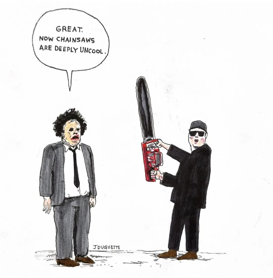 A cartoon depicts a man in a suit and tie with a speech bubble saying 'GREAT. NOW CHAINSAWS ARE DEEPLY UNCOOL.' while facing…