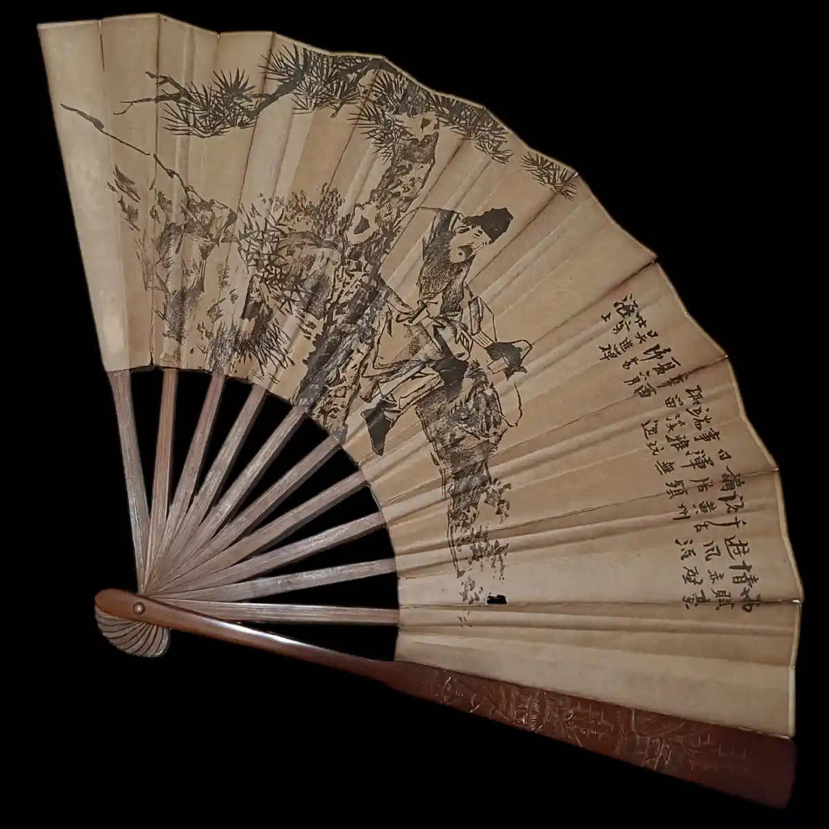 An open traditional Chinese folding fan with a brown wooden handle and paper panels, featuring a black ink painting of a…