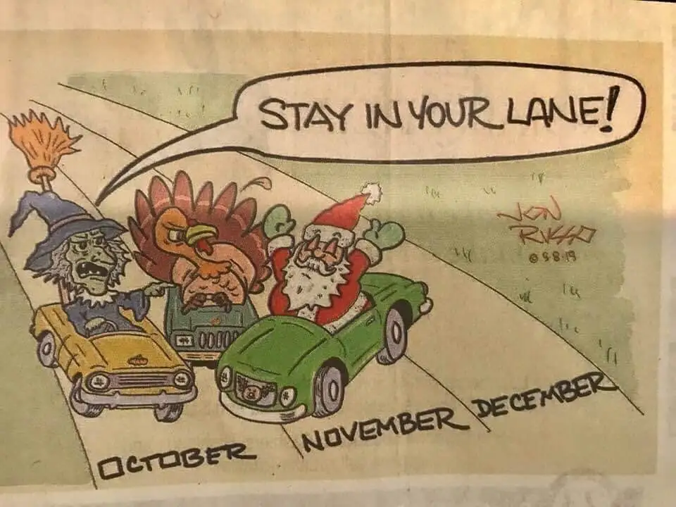 A cartoon depicts three holiday figures—Halloween witch, Thanksgiving turkey, and Christmas Santa—driving cars on a road…