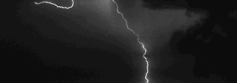 A black-and-white image shows a dark sky with two lightning bolts striking down. Overlaid text reads 'i'm not crying, you're…