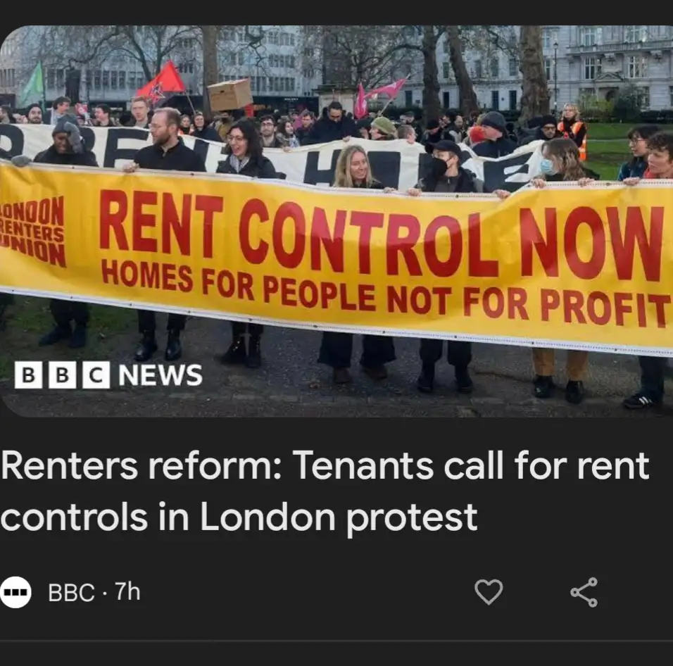 A group of protesters holds a large yellow banner reading 'RENT CONTROL NOW HOMES FOR PEOPLE NOT FOR PROFIT' with 'LONDON…