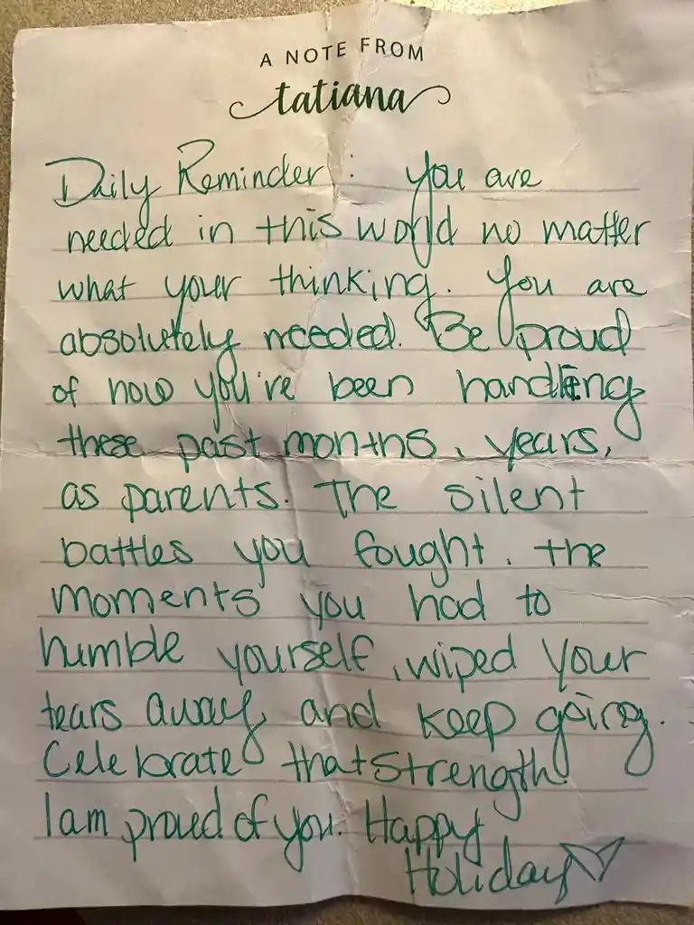 A crumpled piece of lined paper with green cursive handwriting, titled 'A NOTE FROM tatiana'. The note is a daily reminder…