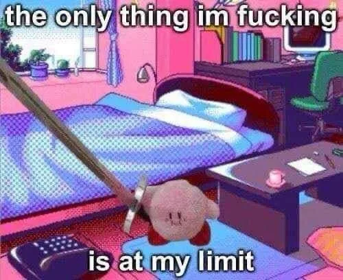 A cartoon image of the character Kirby lying on the floor in a pink bedroom, with a large wooden stick or pole leaning…