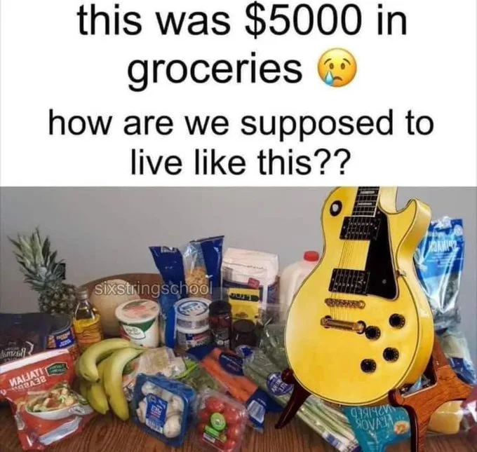 A yellow electric guitar is prominently displayed standing upright among a large assortment of grocery items like bananas…