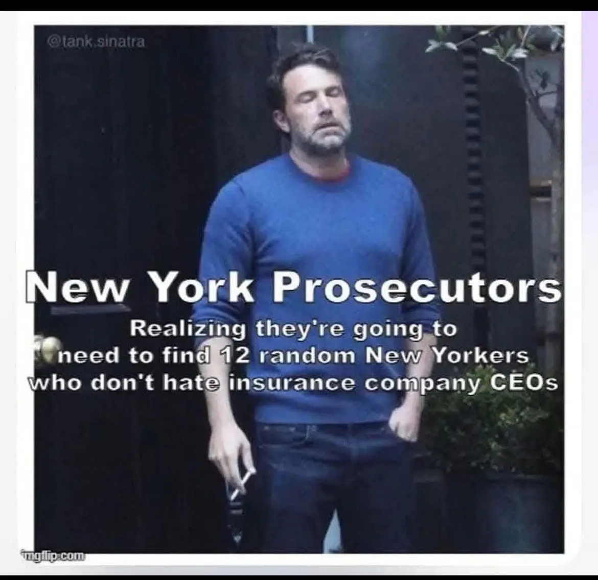 A man in a blue sweater stands with his eyes closed and a resigned expression, holding a cigarette. Overlaid text reads 'New…
