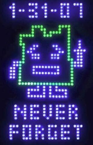 A digital LED display shows the date '1-31-07' at the top, followed by a green pixelated outline of a crying face with a…