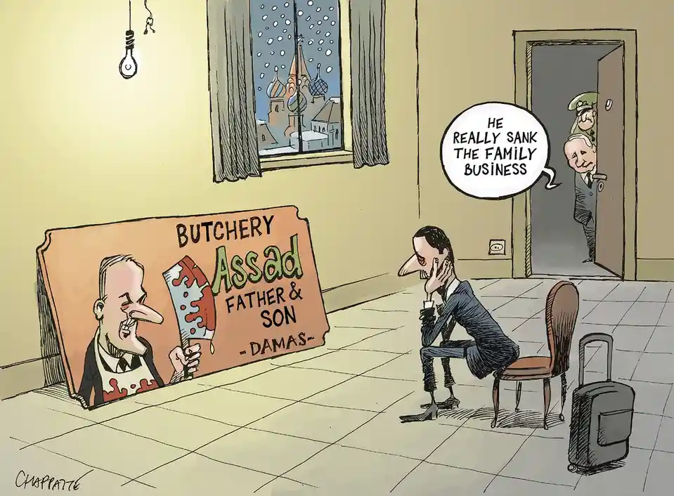 A cartoon depicts a man in a suit sitting dejectedly on a chair with a suitcase beside him, looking at a sign that reads…