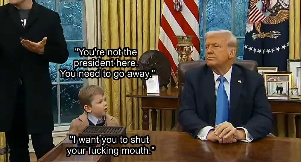 A still image from a video shows a young boy in a suit standing in front of a desk where Donald Trump is seated. The boy is…