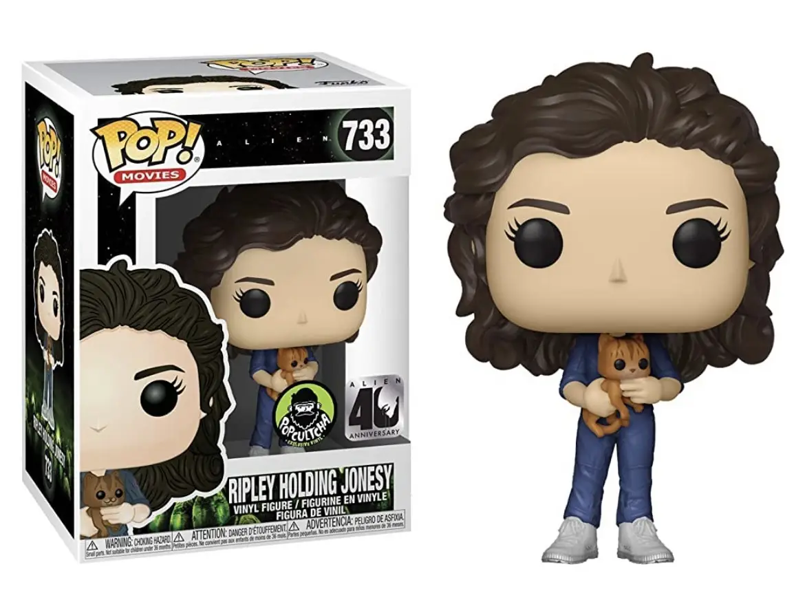 A Funko Pop! vinyl figure of Ellen Ripley from the movie Alien, number 733, holding a small cat-like creature named Jonesy…