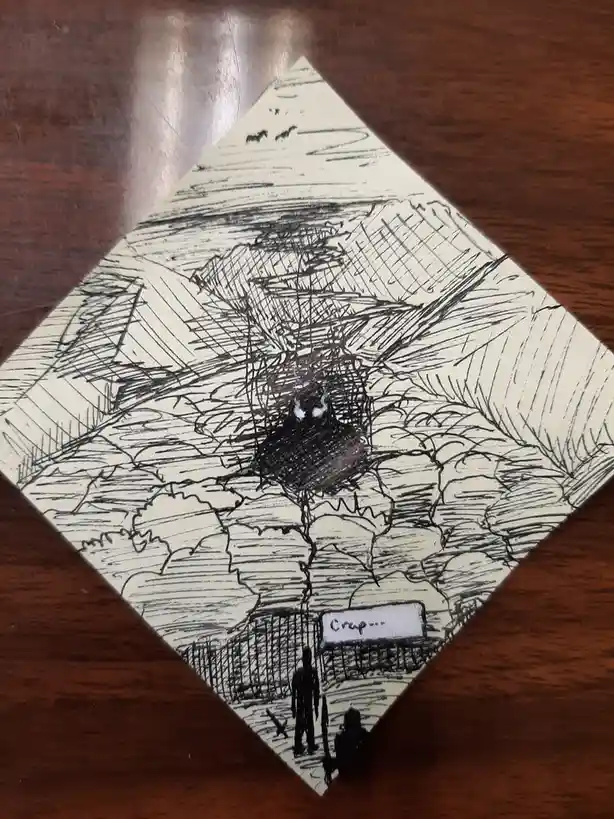 A hand-drawn, black-and-white sketch on a diamond-shaped piece of paper shows two small figures standing before a fence…