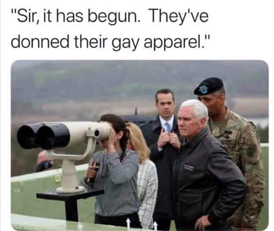 A woman peers through a large public binocular viewer while several men stand nearby, including Mike Pence and a military…