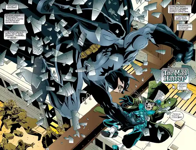Batman breaks through a glass ceiling in a comic panel, smashing down on The Mad Hatter who is cowering below. Speech…