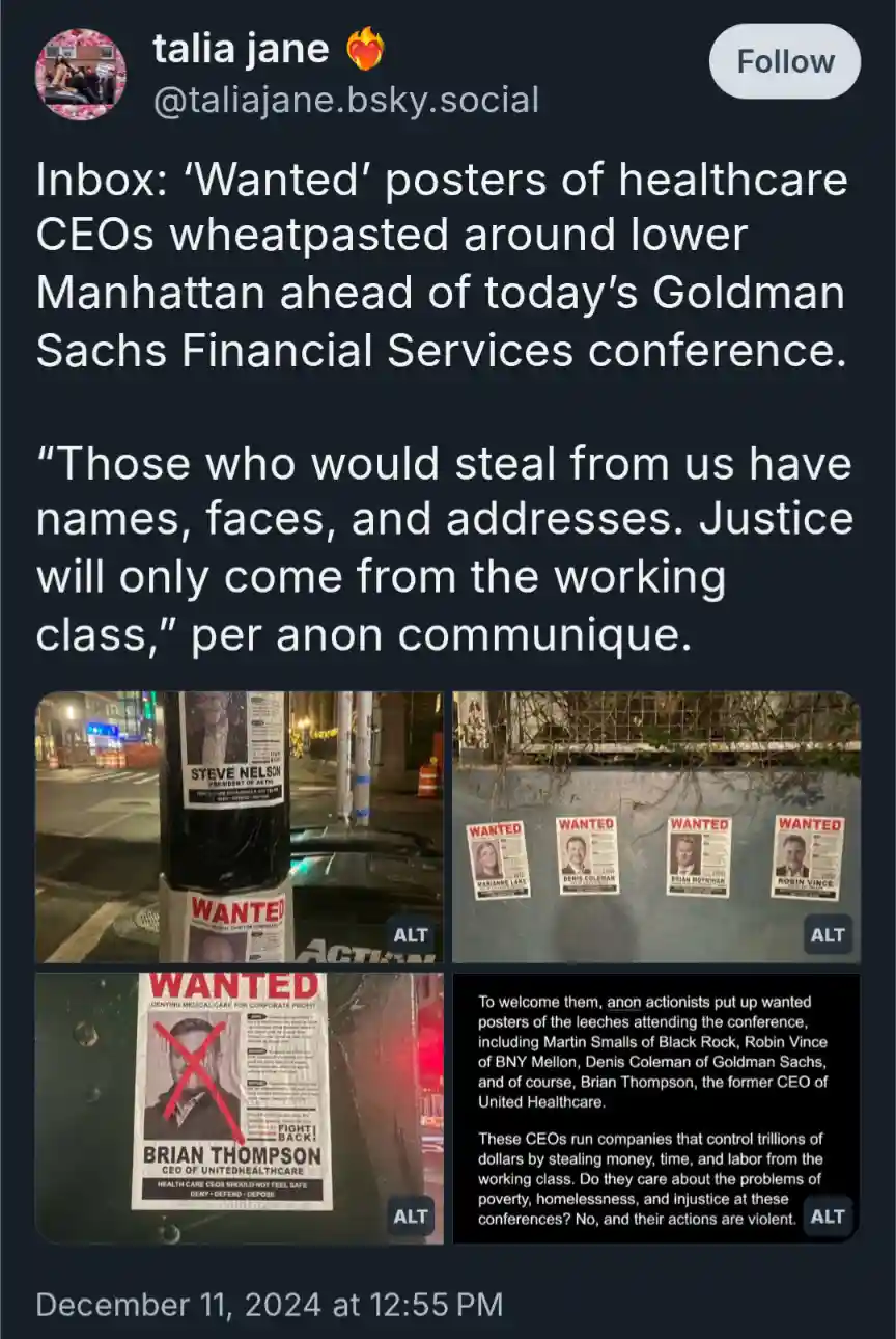 The image displays several 'WANTED' posters affixed to urban surfaces like poles and walls, targeting healthcare CEOs such…
