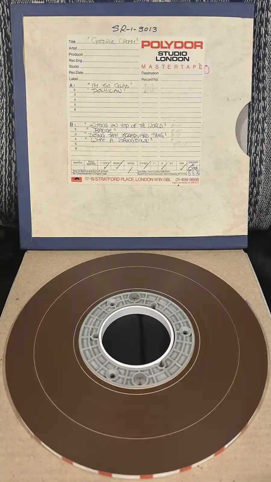 A vintage Polydor studio master tape labeled 'GOODBYE CREAMY' with handwritten track titles like 'I'M SO GLAD'…