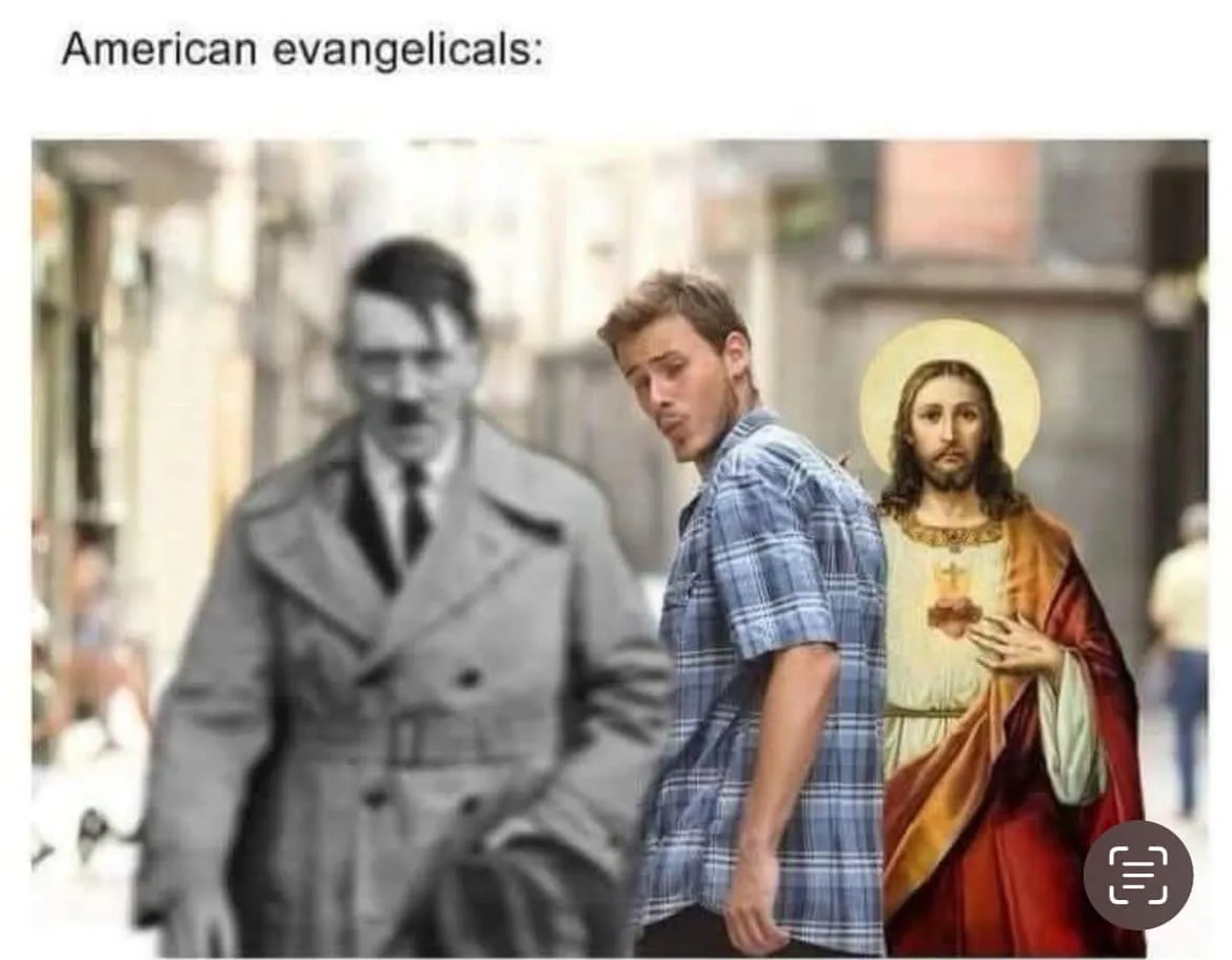 A man in a blue plaid shirt turns his head away from a blurred black-and-white image of Adolf Hitler walking toward him…