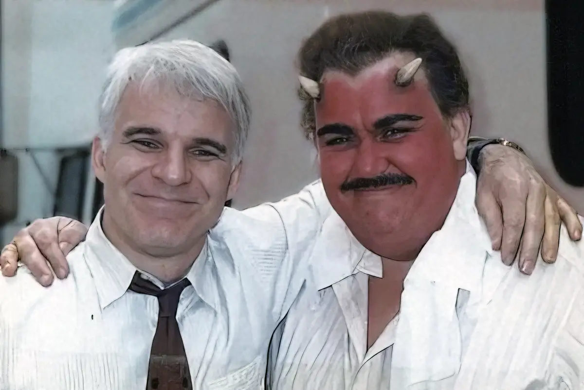 two men are posing for a photo with their arms around each other, both smiling. The man on the right has been digitally…