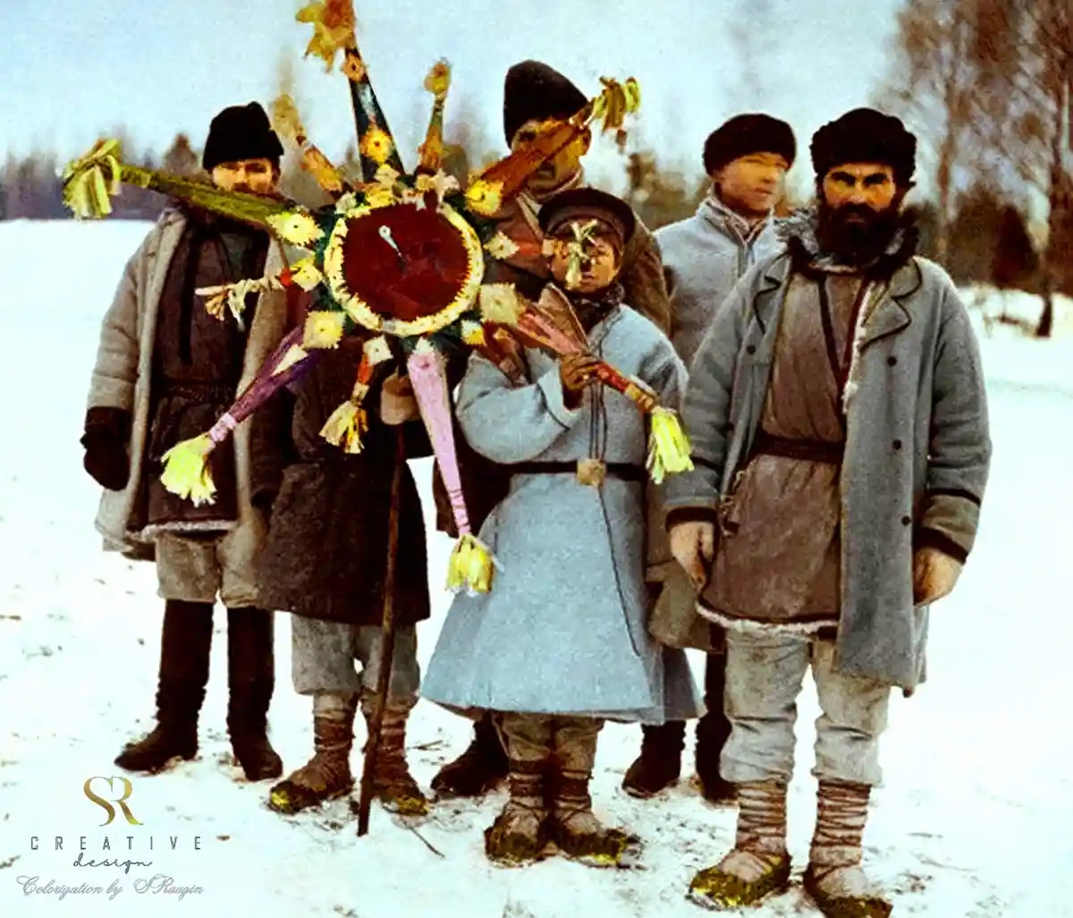 A vintage, colorized photograph shows a group of six men in heavy winter clothing standing in a snowy field. One man in the…