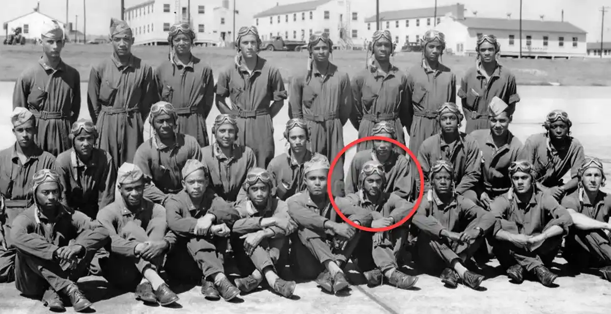 a black and white historical photo of a group of military pilots in uniform posing for a group photo on an airfield, with…