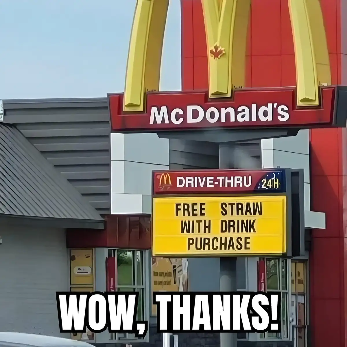 An exterior shot of a McDonald's restaurant with its iconic golden arches and red signage. A yellow marquee sign below reads…