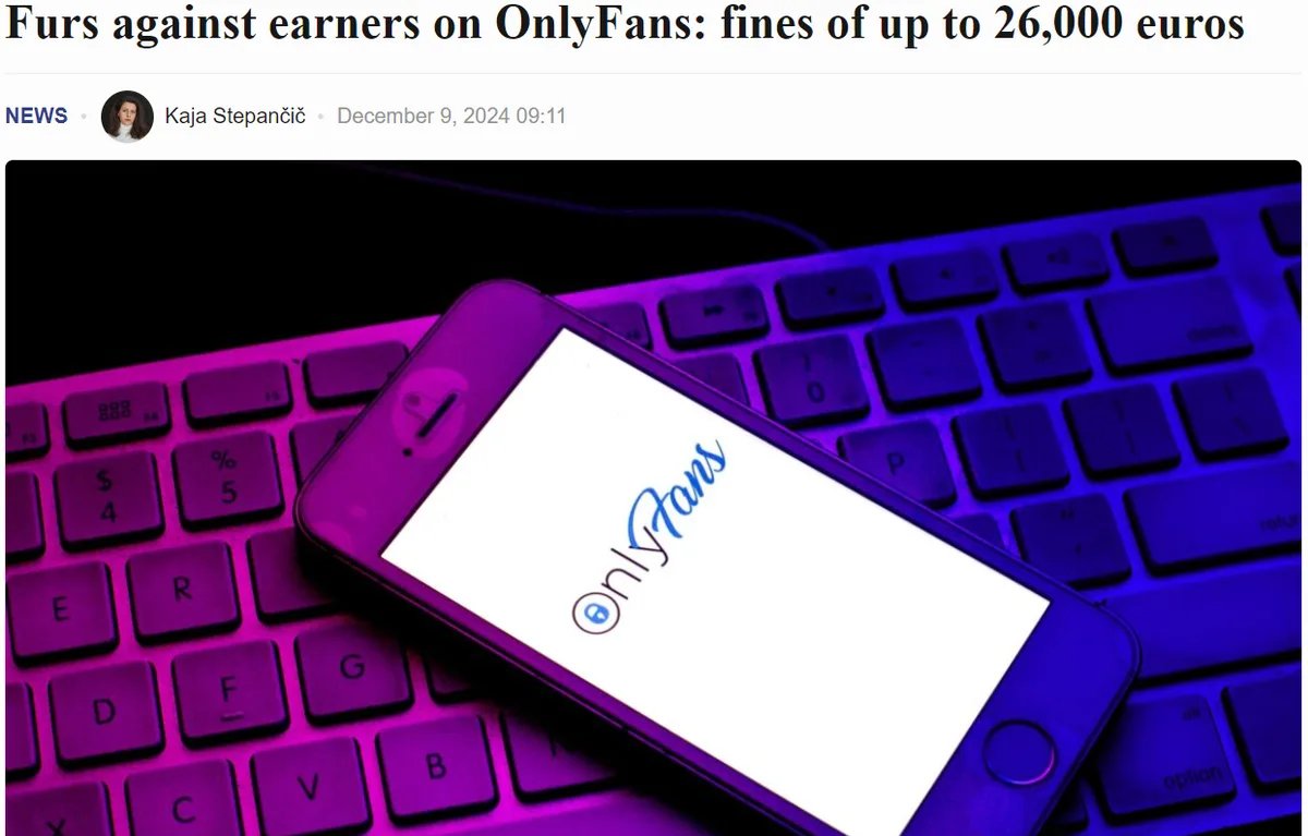 A smartphone displaying the OnlyFans logo rests on a keyboard bathed in purple and blue light. The image is framed as a news…