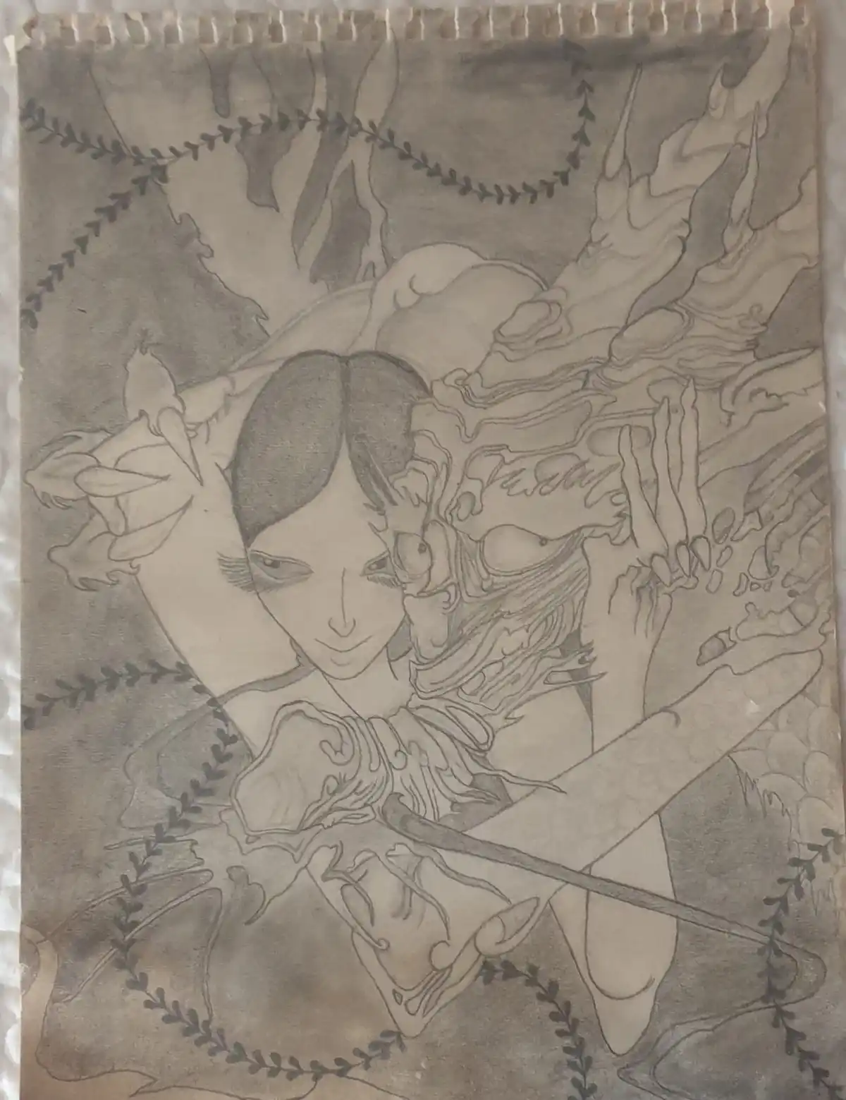 A pencil sketch of a stylized female figure with flowing hair and ornate clothing, surrounded by abstract, flame-like shapes…