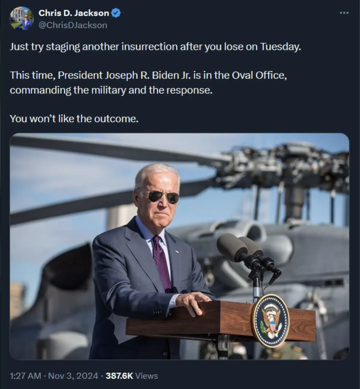 A screenshot of a tweet by Chris D. Jackson shows a photo of President Joe Biden standing at a podium with the presidential…