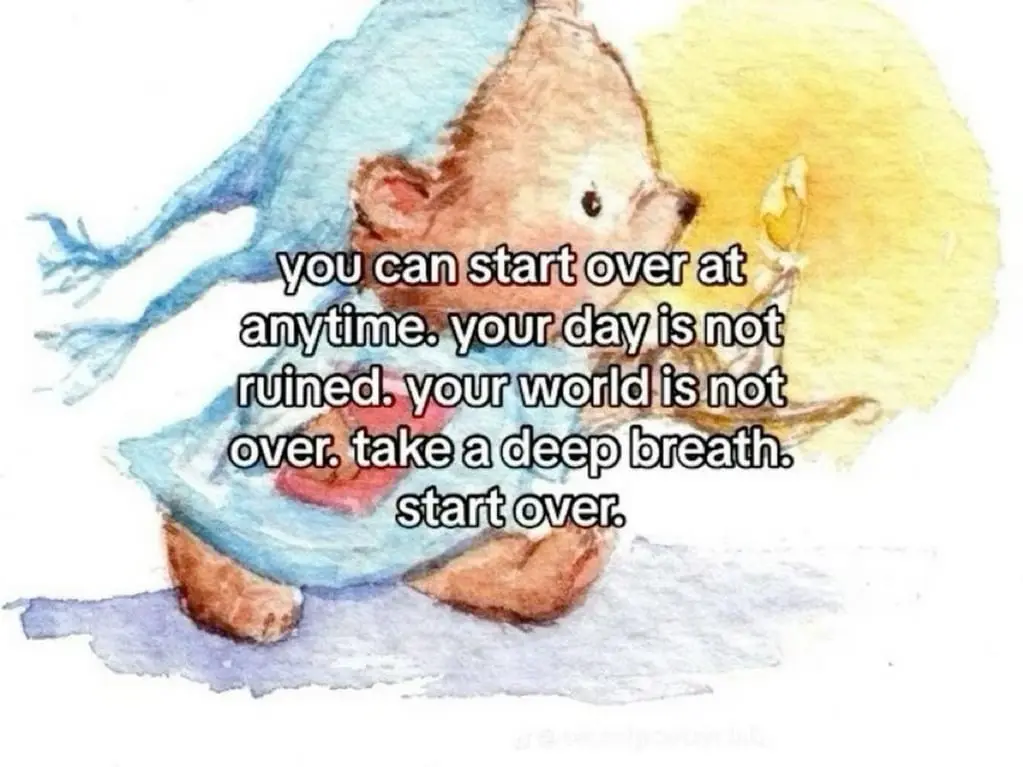 A watercolor illustration shows a small, brown, cartoonish bear wearing a blue hooded robe, sitting on a snowy ground and…