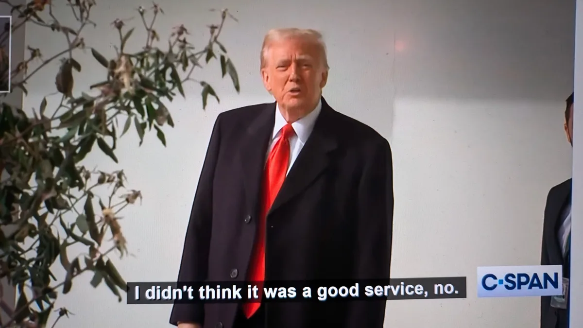 A still image of Donald Trump in a dark suit and red tie, speaking with a serious expression. A C-SPAN logo is visible in…