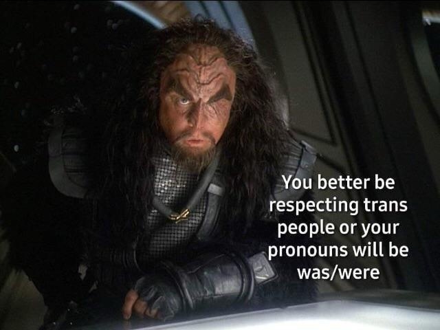 A close-up of a menacing Klingon warrior from Star Trek with a stern, angry expression, overlaid with white text that reads…
