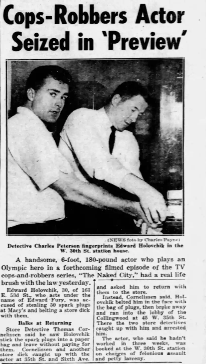 A black-and-white newspaper clipping shows two men, one looking at the camera and the other looking down, with a headline…