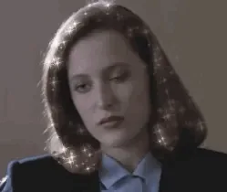 A six-panel image sequence shows a woman with shoulder-length brown hair, wearing a dark blazer over a light blue collared…