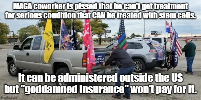 A man in a MAGA hat is loading flags into the bed of a silver pickup truck parked in a lot. The truck is decorated with…
