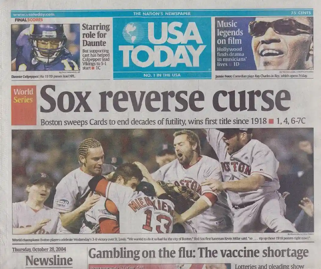 A USA TODAY newspaper front page from October 28, 2004, featuring a photo of Boston Red Sox players celebrating a World…