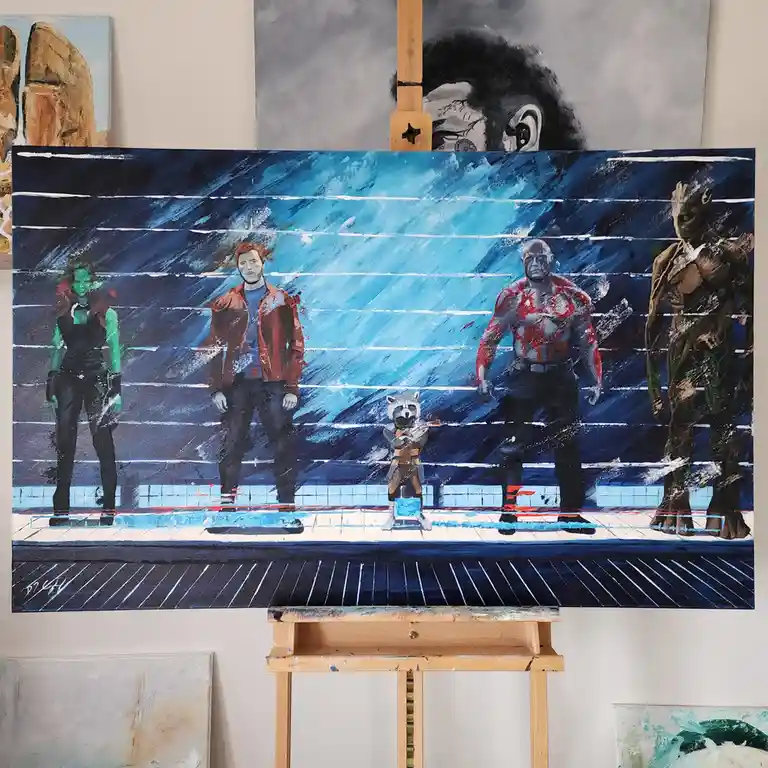 A painting on an easel depicts five characters from Guardians of the Galaxy standing in a row against a blue, streaked…
