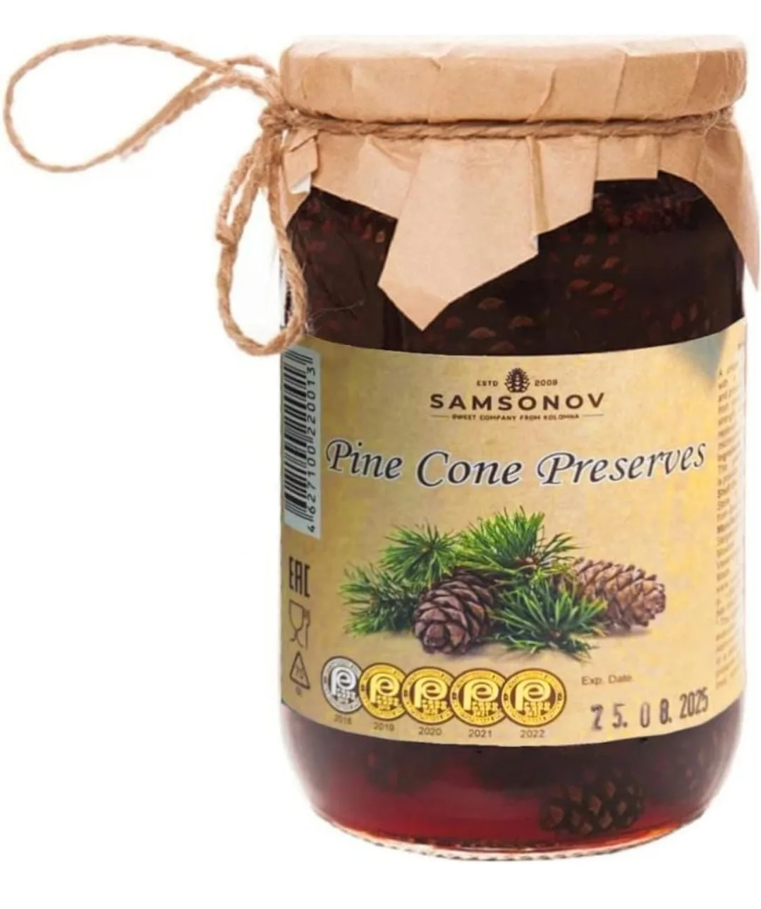 A glass jar of Samsonov Pine Cone Preserves with a brown paper lid tied with twine, featuring a label with pine cones and…