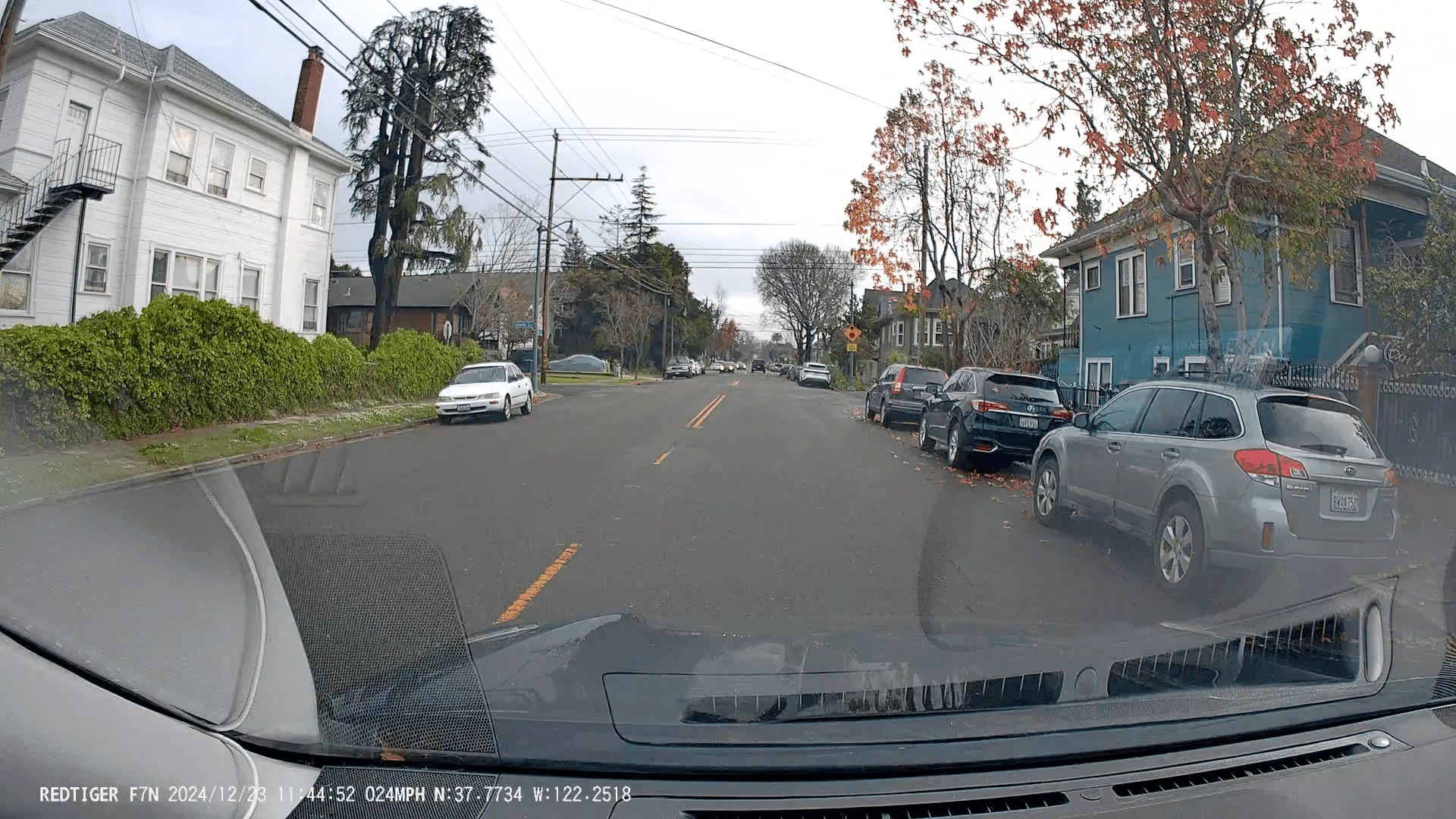 A six-panel dashcam sequence shows a driver approaching an intersection, initially seeing a red SUV ahead, then suddenly the…